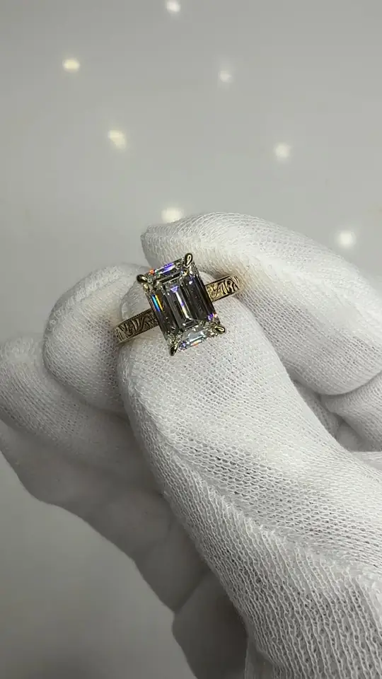 Emerald-cut diamond engagement ring